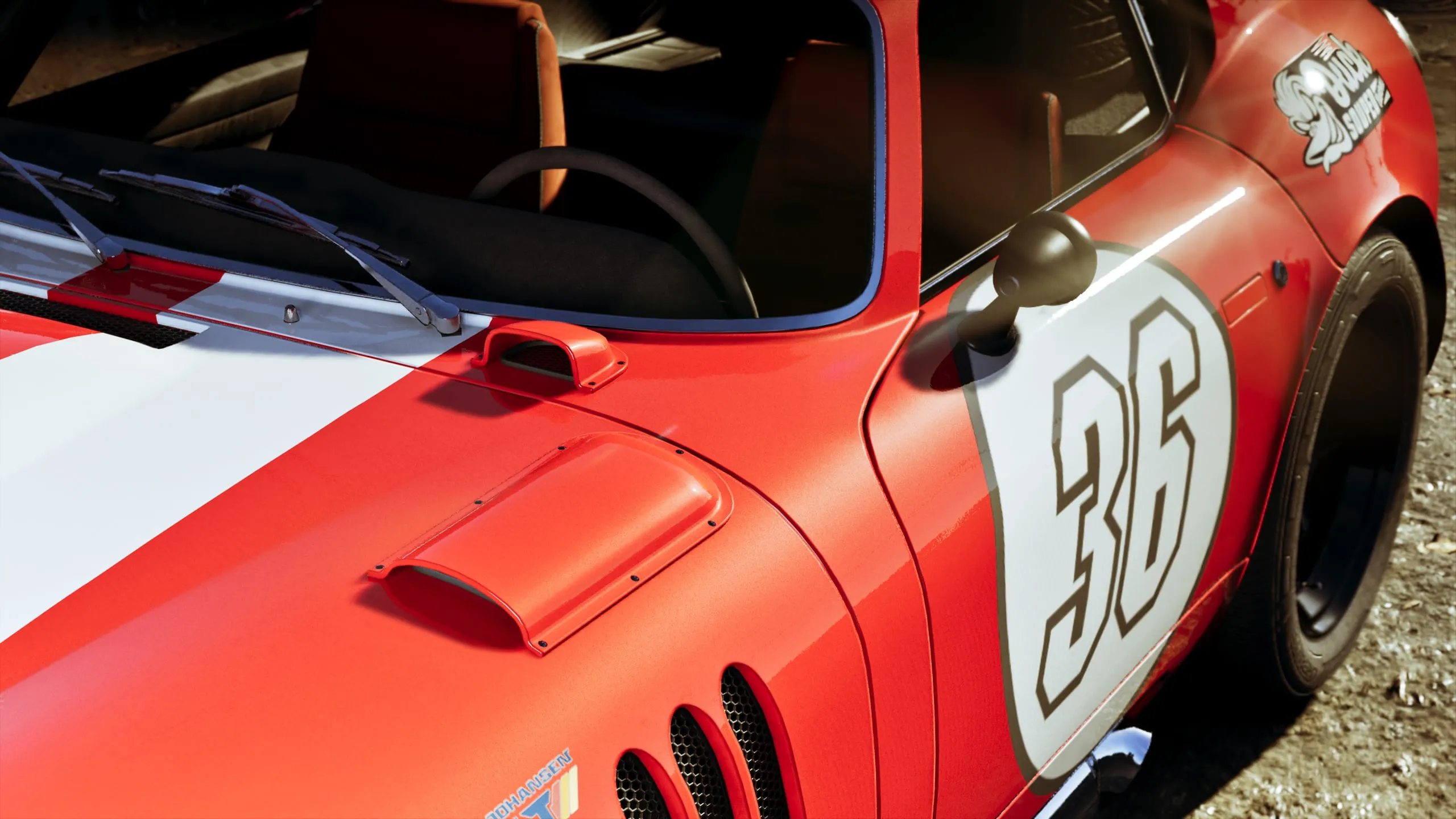A red racing coupe with the number 36 and a Buck Sniper decal