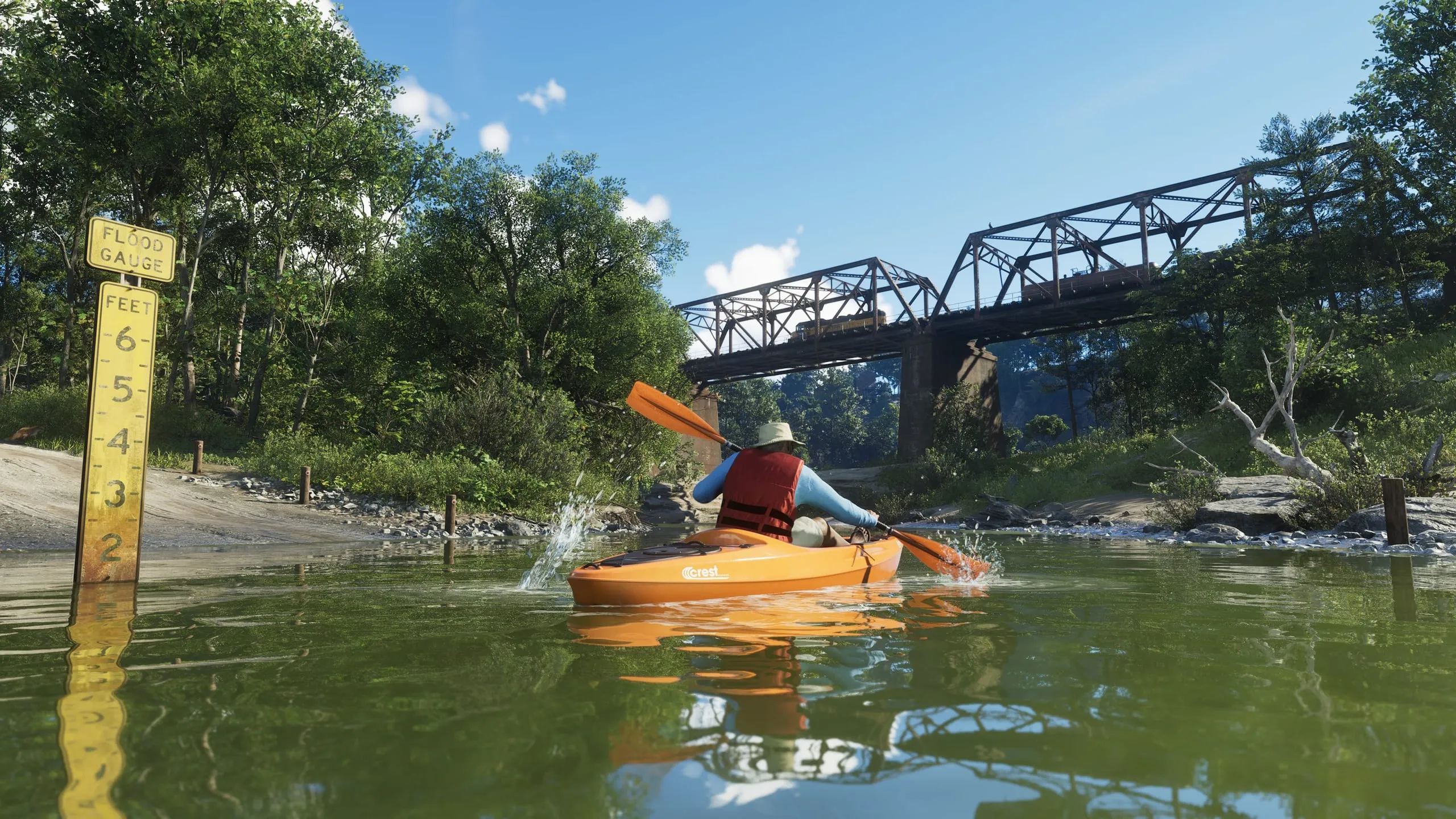 A Crest kayak on the river with a freight train on the bridge