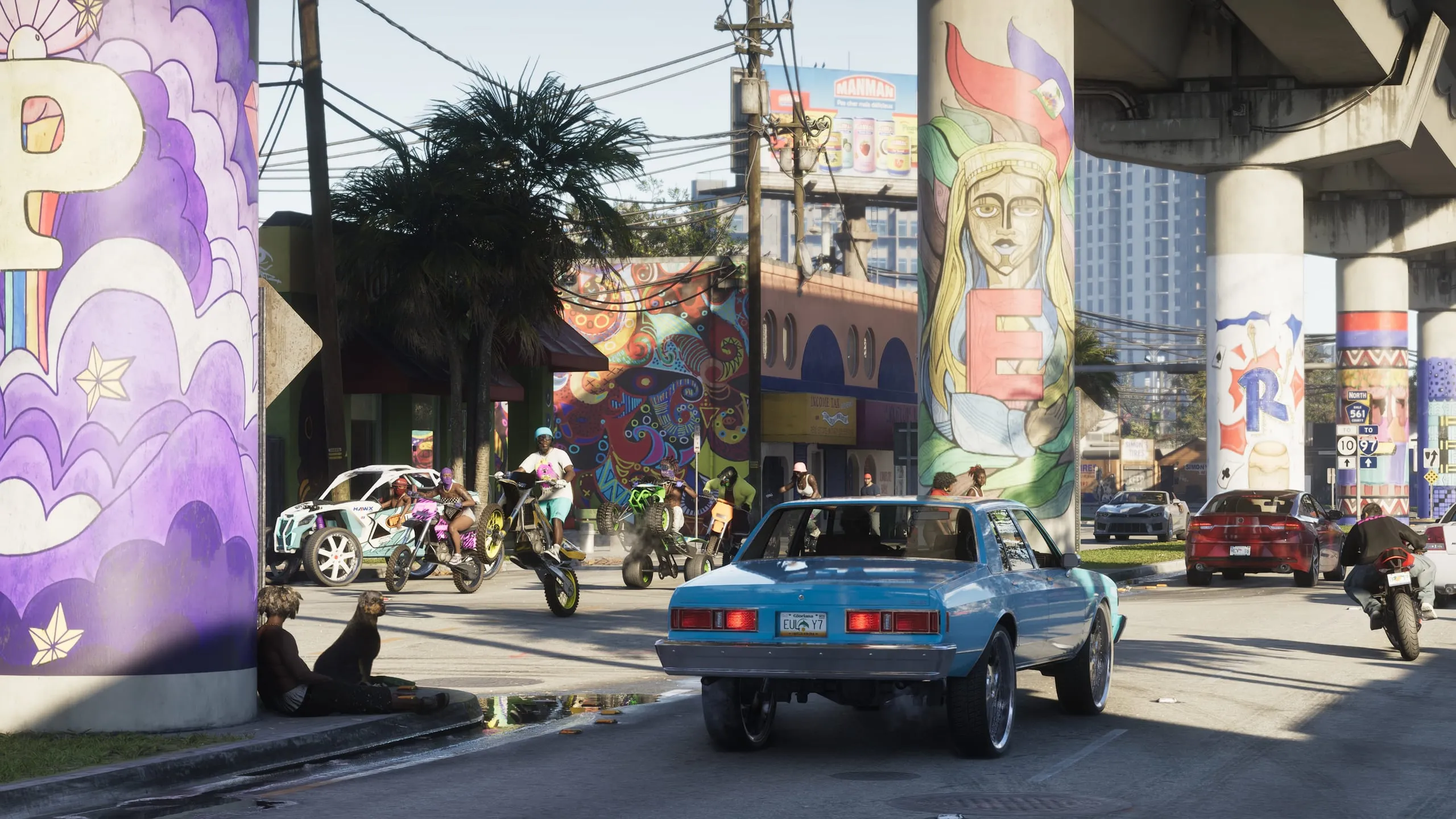 A sky-blue donk on huge wheels under the Little Haiti overpass